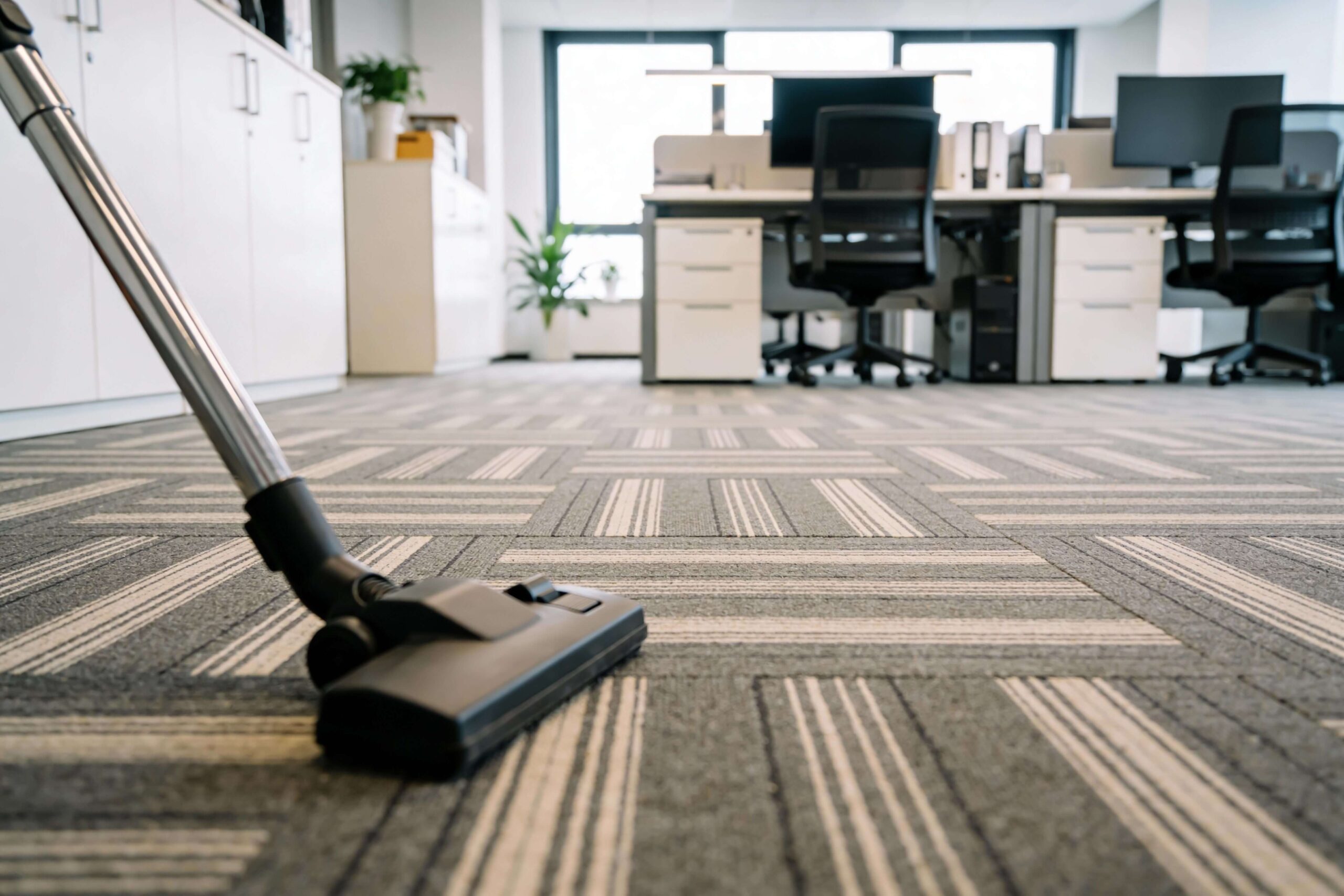 Professional commercial cleaning Braeside service vacuuming office carpet to maintain a clean and hygienic workplace.